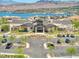 Exterior view of the community clubhouse surrounded by well-maintained landscaping and ample parking at 25 Red Creek Bluff St, Henderson, NV 89011