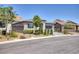 Inviting single-story home featuring well-maintained landscaping and a convenient two-car garage at 25 Red Creek Bluff St, Henderson, NV 89011