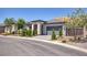 Charming single-story home with a neatly landscaped front yard and a spacious two-car garage at 25 Red Creek Bluff St, Henderson, NV 89011