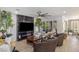 Elegant living room featuring a marble fireplace, ceiling fan, and a large window for natural light at 25 Red Creek Bluff St, Henderson, NV 89011