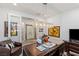 Spacious home office with a large desk, leather chair, and stylish lighting at 25 Red Creek Bluff St, Henderson, NV 89011