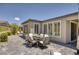 Spacious outdoor patio with a dining table and chairs, ideal for al fresco dining and enjoying the beautiful weather at 25 Red Creek Bluff St, Henderson, NV 89011