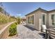 Serene outdoor patio showcases a dining table set, blending relaxation and social ambiance in a tranquil space at 25 Red Creek Bluff St, Henderson, NV 89011