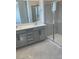 Modern bathroom with dual sink vanity and glass enclosed shower at 2536 Vandra St, Las Vegas, NV 89138