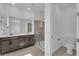 This spacious bathroom features a double vanity, tile floors, and a glass shower at 2536 Vandra St, Las Vegas, NV 89138