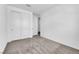 Clean bedroom featuring carpeted floors, bright lighting, and closet with sliding doors at 2536 Vandra St, Las Vegas, NV 89138