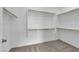 This walk-in closet features carpeted floors and white shelving with wooden rods at 2536 Vandra St, Las Vegas, NV 89138