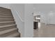 Inviting entryway with carpeted stairs leading to a bright, open-concept living area at 2536 Vandra St, Las Vegas, NV 89138