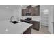 Modern kitchen with gas range, stainless steel microwave, and quartz countertops at 2536 Vandra St, Las Vegas, NV 89138