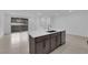 A kitchen island with stainless steel dishwasher and large sliding door leading to outdoor at 2536 Vandra St, Las Vegas, NV 89138