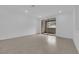 Spacious living area featuring tile flooring, recessed lighting, and access to an outdoor patio at 2536 Vandra St, Las Vegas, NV 89138