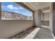 Covered outdoor patio with stone columns, pavers, and a gate offers a private outdoor space at 2536 Vandra St, Las Vegas, NV 89138