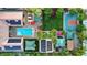 Bird's eye view of a property featuring a pool, a basketball court, lush landscaping, and outdoor dining spaces at 2822 Ashby Ave, Las Vegas, NV 89102