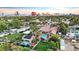 Las Vegas property featuring a pool, a lush green lawn, mature landscaping and solar panels set against the city skyline at 2822 Ashby Ave, Las Vegas, NV 89102