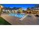 Backyard featuring a large rectangular pool, hot tub and covered outdoor kitchen at 2822 Ashby Ave, Las Vegas, NV 89102