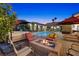 Inviting backyard with a fire pit, seating area, and pool, perfect for outdoor entertaining with spa and play area at 2822 Ashby Ave, Las Vegas, NV 89102
