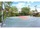 Wide angle view of the basketball court featuring mature trees and lush landscaping at 2822 Ashby Ave, Las Vegas, NV 89102