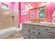 Cute bathroom with a double sink vanity, granite counters and walk-in shower at 2822 Ashby Ave, Las Vegas, NV 89102