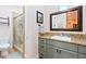 Bathroom with granite counters, a shower, and a large mirror, conveniently located near the office for easy access at 2822 Ashby Ave, Las Vegas, NV 89102