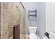 Modern bathroom with a glass-enclosed shower, granite countertops, and neutral tones offering a sleek and clean look at 2822 Ashby Ave, Las Vegas, NV 89102