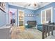 Cozy bedroom featuring a crib, gray dresser, walk-in closet and en-suite bathroom at 2822 Ashby Ave, Las Vegas, NV 89102