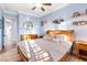 Bright bedroom with crown molding, wood-look floors, ceiling fan, and natural light at 2822 Ashby Ave, Las Vegas, NV 89102