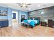 Modern bedroom featuring wood-paneled accent wall and a blue color scheme at 2822 Ashby Ave, Las Vegas, NV 89102