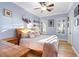 Bright bedroom with crown molding, wood-look floors, ceiling fan, and natural light at 2822 Ashby Ave, Las Vegas, NV 89102