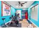 Bonus room with fitness equipment, a mini fridge, and bright decor, perfect for workouts and entertainment at 2822 Ashby Ave, Las Vegas, NV 89102