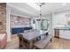 Open concept dining area features a long table with chairs and bench at 2822 Ashby Ave, Las Vegas, NV 89102
