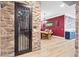 Dining room featuring stone accents, hardwood floors, and a table adjacent to the decorative wall at 2822 Ashby Ave, Las Vegas, NV 89102