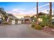 This home features a spacious driveway with desert landscaping and a three-car garage at 2822 Ashby Ave, Las Vegas, NV 89102