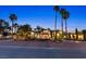 Expansive home featuring a lush yard, towering palm trees, and an elegant exterior at 2822 Ashby Ave, Las Vegas, NV 89102