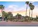 Inviting single-story home with well-maintained landscaping and tall palm trees at 2822 Ashby Ave, Las Vegas, NV 89102