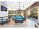 Entertaining game room with a pool table, wet bar, TV, and indoor-outdoor access at 2822 Ashby Ave, Las Vegas, NV 89102