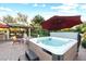 Backyard view of the hot tub, fire pit, outdoor kitchen and gazebo at 2822 Ashby Ave, Las Vegas, NV 89102