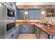 Modern kitchen with granite countertops, stone backsplash, stainless appliances and custom cabinets at 2822 Ashby Ave, Las Vegas, NV 89102