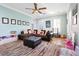 Inviting living room with a large sectional couch, play area and plantation shutters at 2822 Ashby Ave, Las Vegas, NV 89102