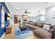 Open concept living room includes a view of fireplace, kitchen and comfortable furniture at 2822 Ashby Ave, Las Vegas, NV 89102