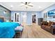 Spacious main bedroom featuring luxury vinyl flooring, ensuite baths, and walk-in closets at 2822 Ashby Ave, Las Vegas, NV 89102