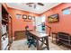Bright home office featuring modern desk, chair, and TV with an outdoor view at 2822 Ashby Ave, Las Vegas, NV 89102