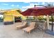 Backyard outdoor kitchen with seating and umbrellas at 2822 Ashby Ave, Las Vegas, NV 89102