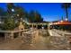 Extensive outdoor kitchen featuring stone accents, stainless steel grill, bar seating, and brick-paved patio at 2822 Ashby Ave, Las Vegas, NV 89102