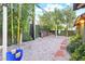 Backyard play area featuring a swing set, lush greenery, and decorative rock landscaping for Gathering fun at 2822 Ashby Ave, Las Vegas, NV 89102