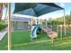 Backyard playground with climbing structure, slide, and soft turf surface at 2822 Ashby Ave, Las Vegas, NV 89102