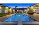 Gorgeous in-ground pool and diving board surrounded by a paver patio and backyard at 2822 Ashby Ave, Las Vegas, NV 89102