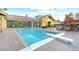 Outdoor pool with diving board, lounge chairs, patio umbrella and bi-fold doors to home at 2822 Ashby Ave, Las Vegas, NV 89102
