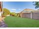 Grassy backyard with block wall and landscaping offers privacy and space for outdoor enjoyment at 286 Fairmeadow St, Henderson, NV 89012