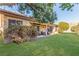 Secluded backyard features a covered patio, lush lawn, and mature landscaping at 286 Fairmeadow St, Henderson, NV 89012