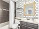 Well-lit bathroom featuring vanity, toilet and shower-tub combo with modern fixtures at 286 Fairmeadow St, Henderson, NV 89012